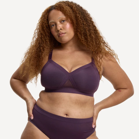 Model wearing the Padded Support Wirefree Bralette and matching briefs in plum