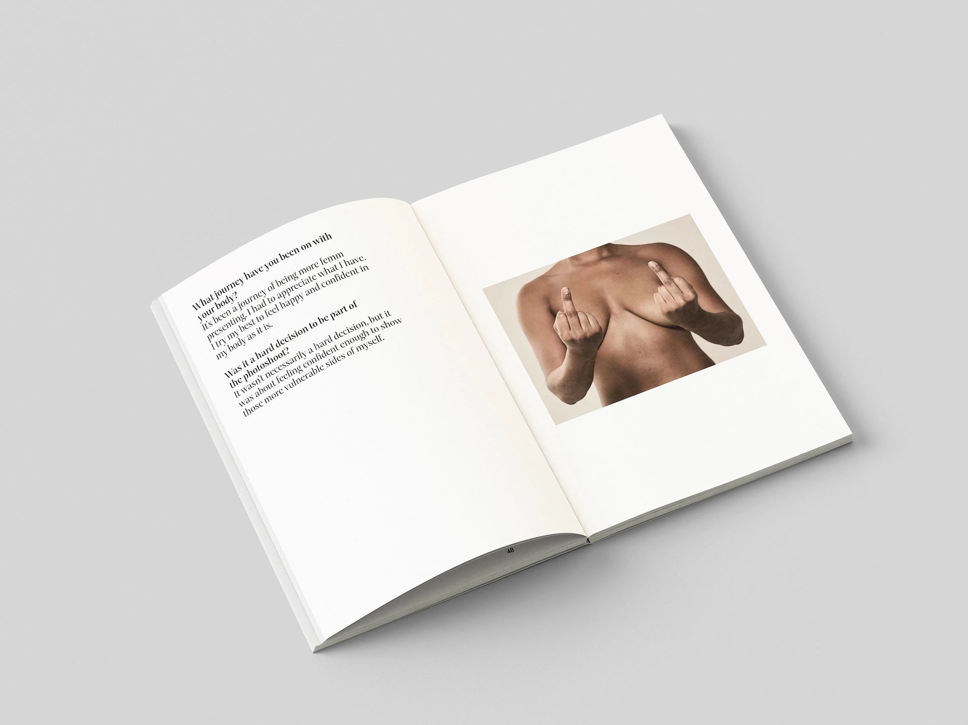 The Chests book open to a spread pairing a portrait of a bare chest with an essay page